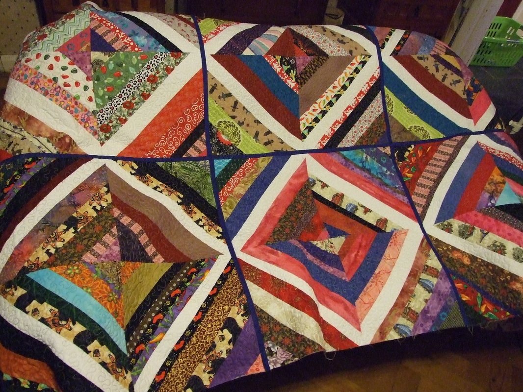 string quilt blocks made into quilt